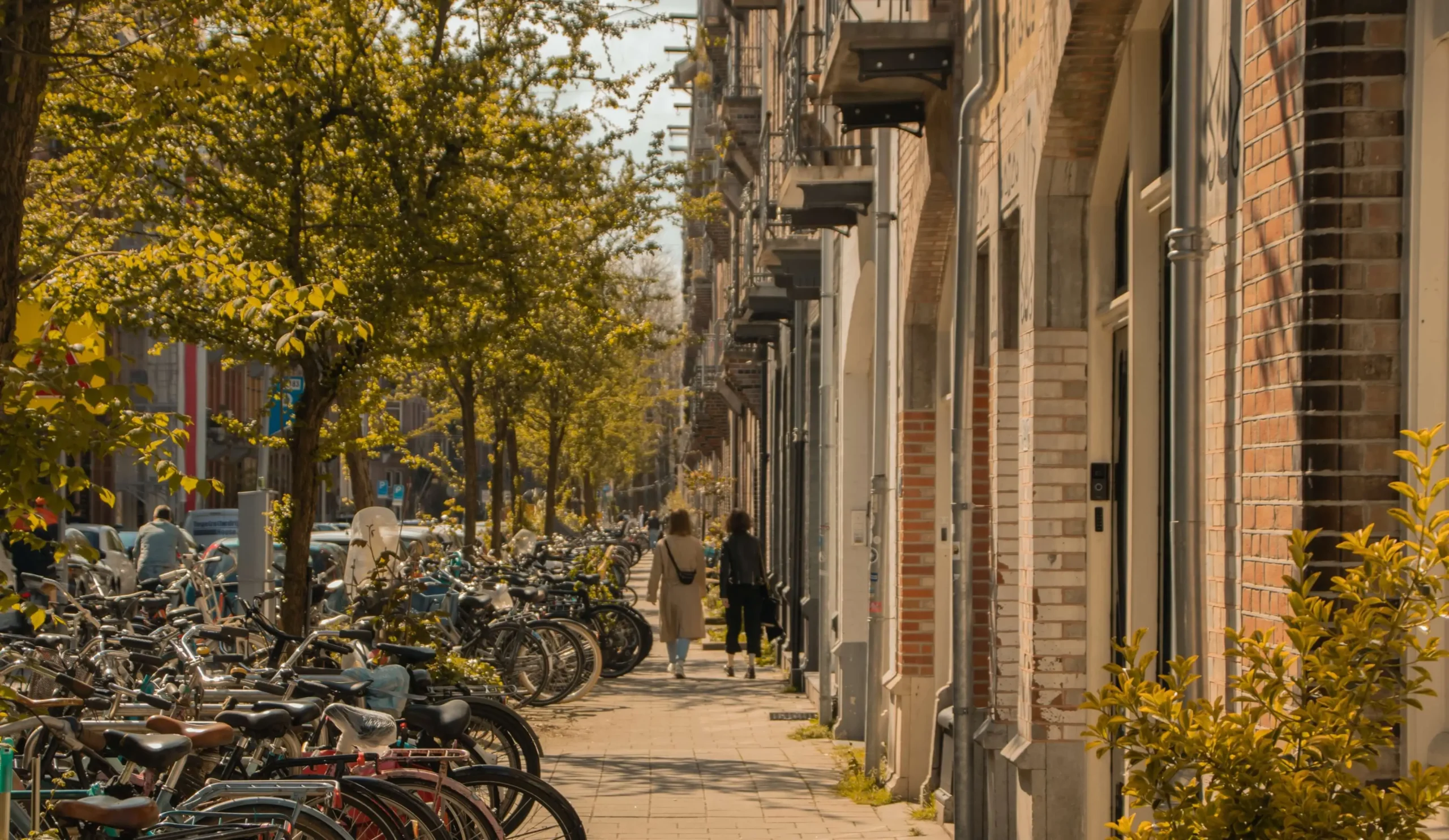 Ladies walking down a street in De Pijp neighbourhood of Amsterdam