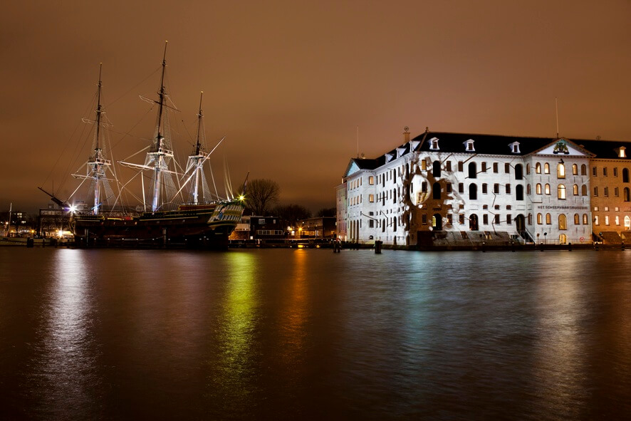 Mr Beam art installation at the very first Amsterdam Light Festival shining onto Scheepvaartmuseum