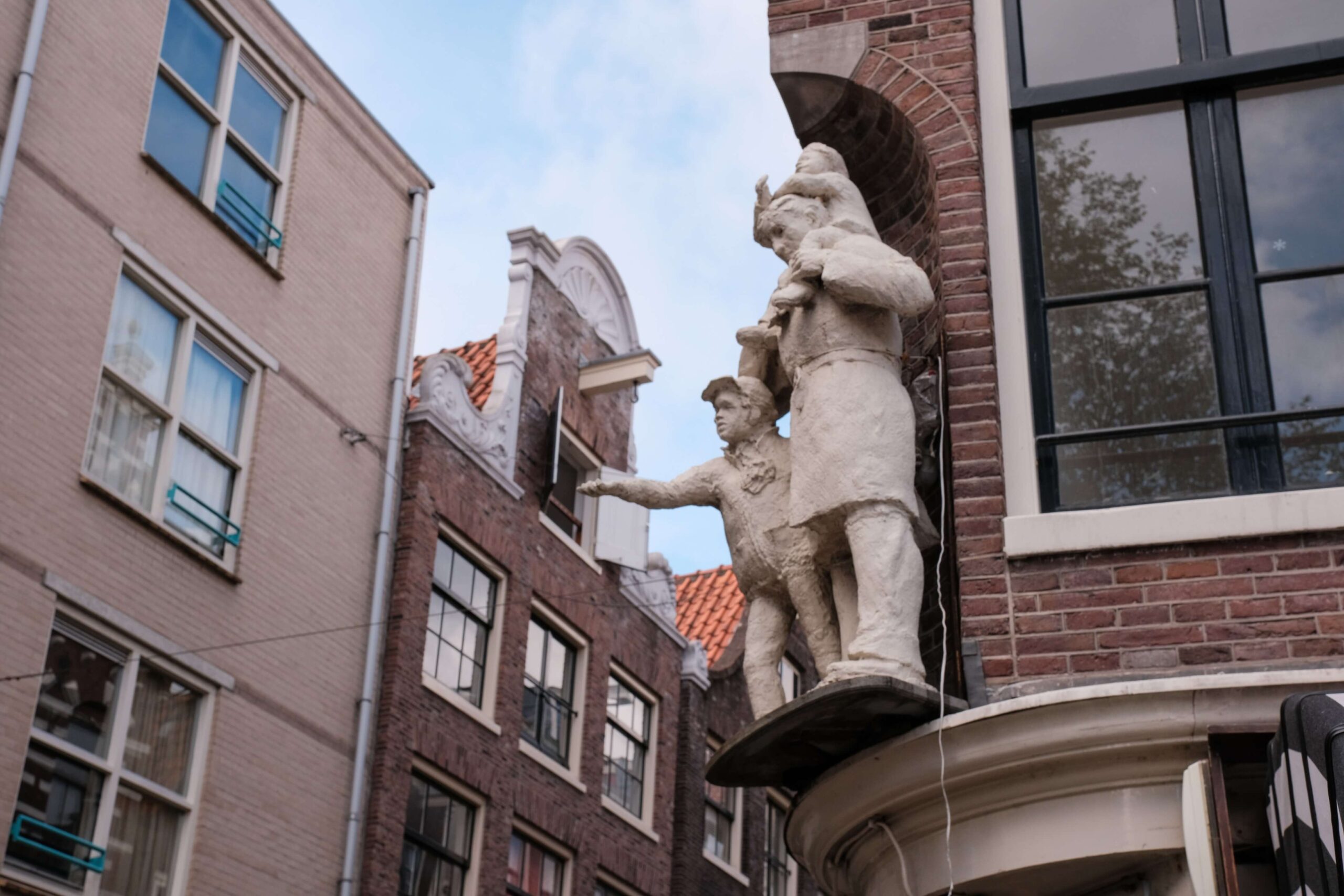 A statue on one of the historic streets of Amsterdam
